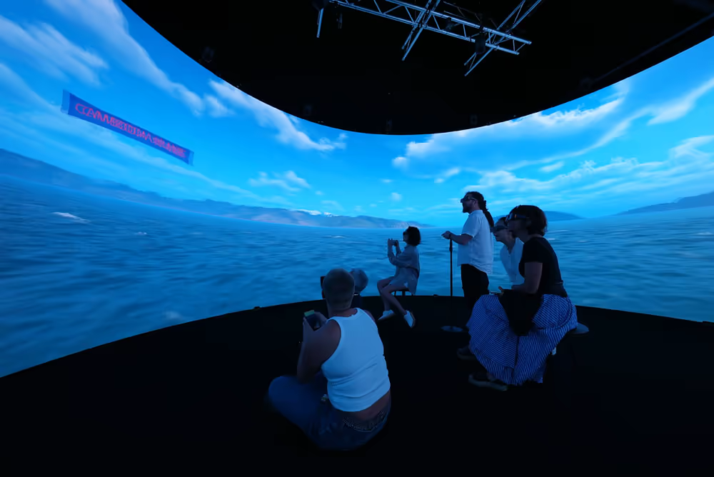 Ocean navigation sequence on the cylindrical display, with distant landmasses and country labels.