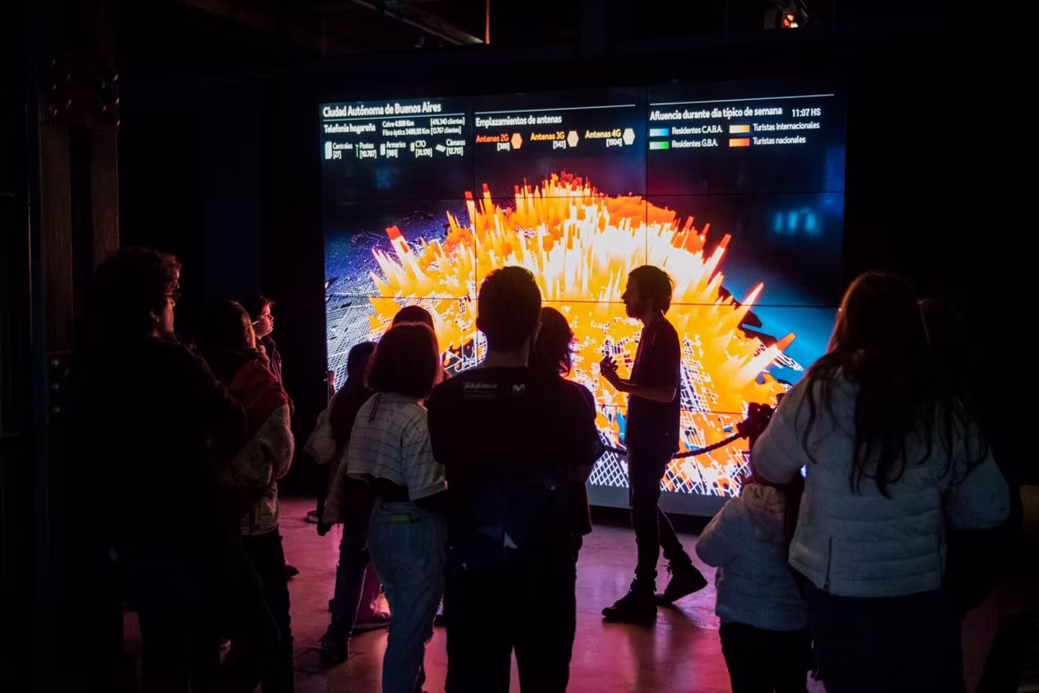 Audience facing the main orange visualisation