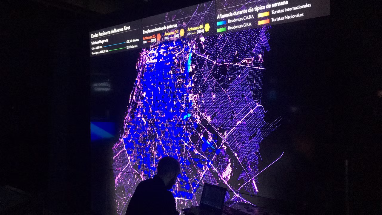 Visitor silhouette against the blue map visualisation