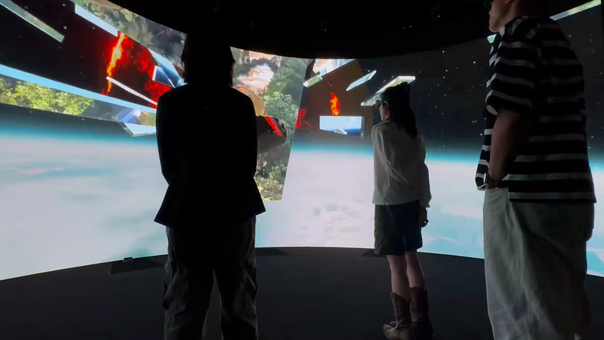Silhouettes watching fragmented collage sequence — VRC nVis screen