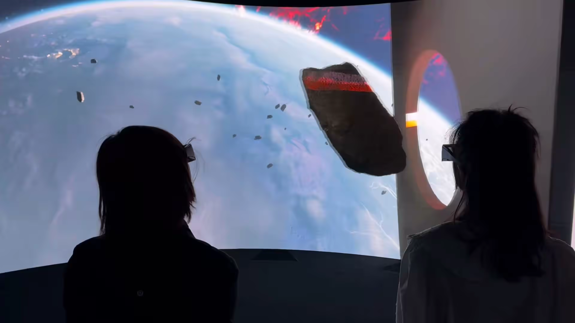 Two silhouettes — orbital Earth scene with asteroid, VRC