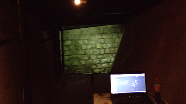 Interactive installation prototype showing the projected tunnel and control laptop