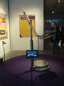 V-Dome installed on a circular platform during an exhibition presentation