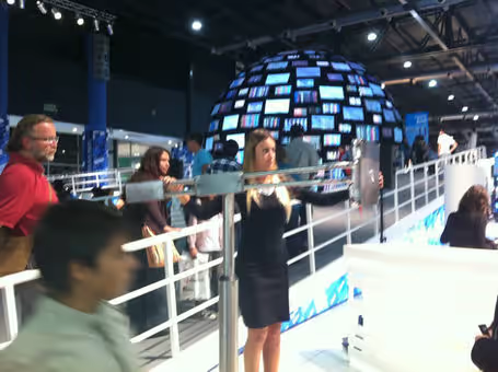 A visitor interacting with the V-Dome at the Frankfurt Book Fair