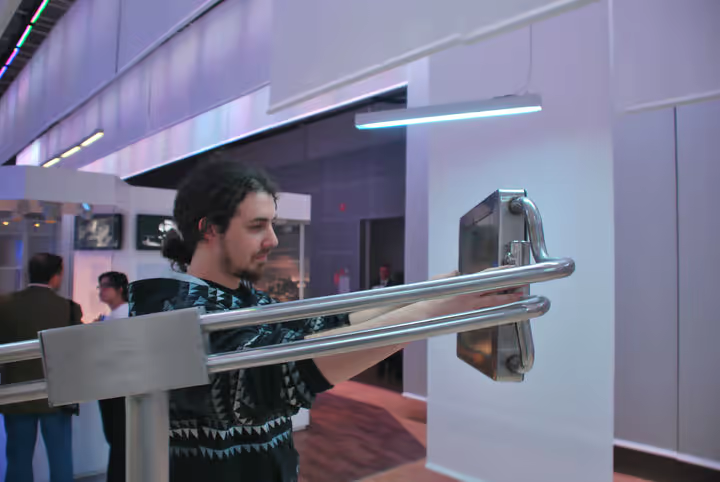 User interacting with the V-Dome screen at close range