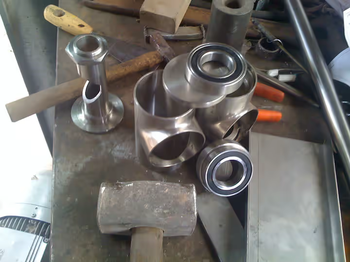 Machined stainless-steel joint components prepared for assembly