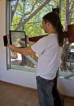 Technical render showing the movement range and ergonomic study of the device