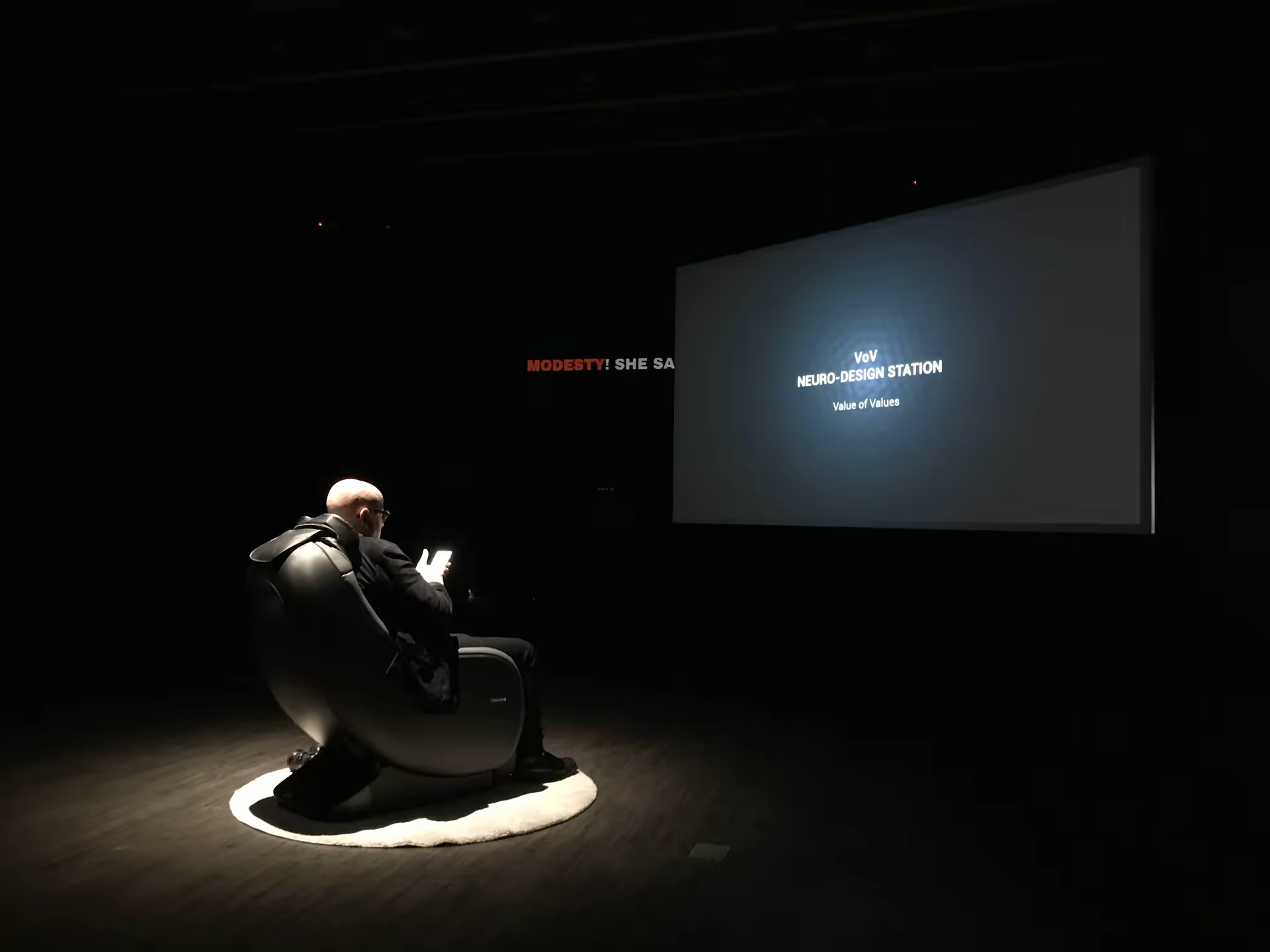 Maurice Benayoun seated in the chair during the installation